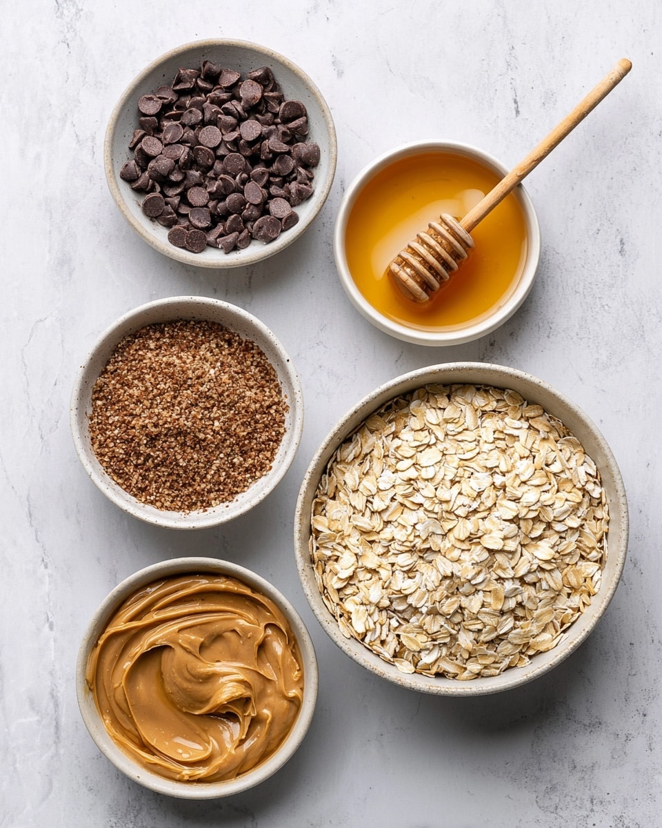 The image shows five white bowls on a white marbled surface, each filled with different ingredients. The largest bowl on the right is filled with light beige rolled oats, showing a rough and dry texture. At the top right, a smaller bowl contains golden honey with a wooden honey dipper resting inside, its ridges coated in honey. The top left white bowl holds numerous small, dark brown chocolate chips with a smooth finish. Below it, another bowl is filled with finely ground brown flaxseed meal, having a powdery texture. The bottom left bowl contains smooth, light brown peanut butter with a shiny surface and a spoon partially inside it. The setup is evenly lit and clear, showing the contrast between the different textures and colors of the ingredients. photo taken with an iphone --ar 4:5 --v 7