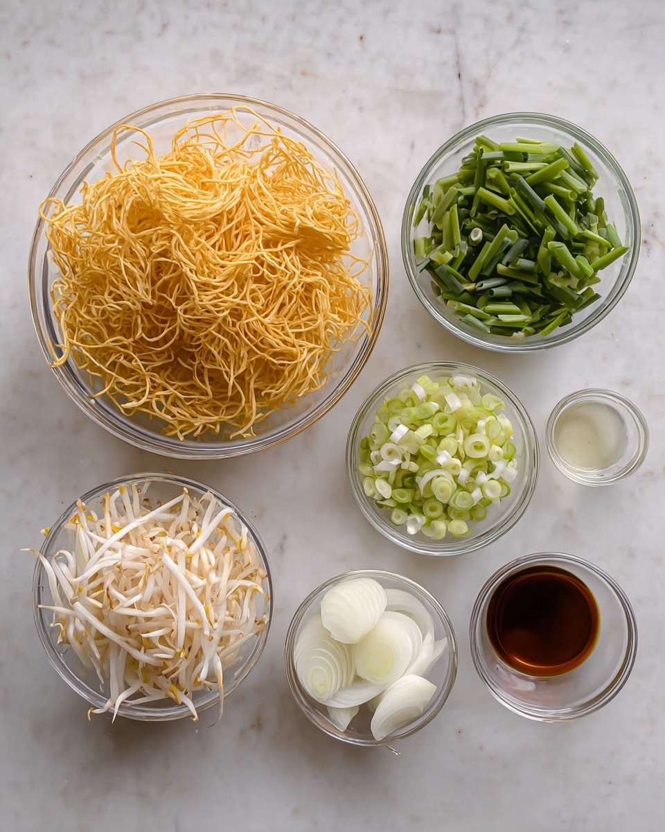 The image shows seven small clear glass bowls arranged on a surface with a white marbled texture. On the left, there is one large bowl filled with crispy fried golden-yellow noodles, with many thin, tangled strands. Below it, a medium bowl holds white bean sprouts with a small piece of firm white ingredient at the bottom center. Above and to the right, there are three small bowls with different green onion parts: the top left bowl has dark green chopped green onions, the middle bowl has light green and white round green onion pieces, and alongside them is a small bowl with a clear liquid. Beneath those, another small bowl holds thin white sliced onions, and beside it is a small bowl with a dark brown liquid. The bowls are neatly placed on the white marbled surface. Photo taken with an iphone --ar 4:5 --v 7
