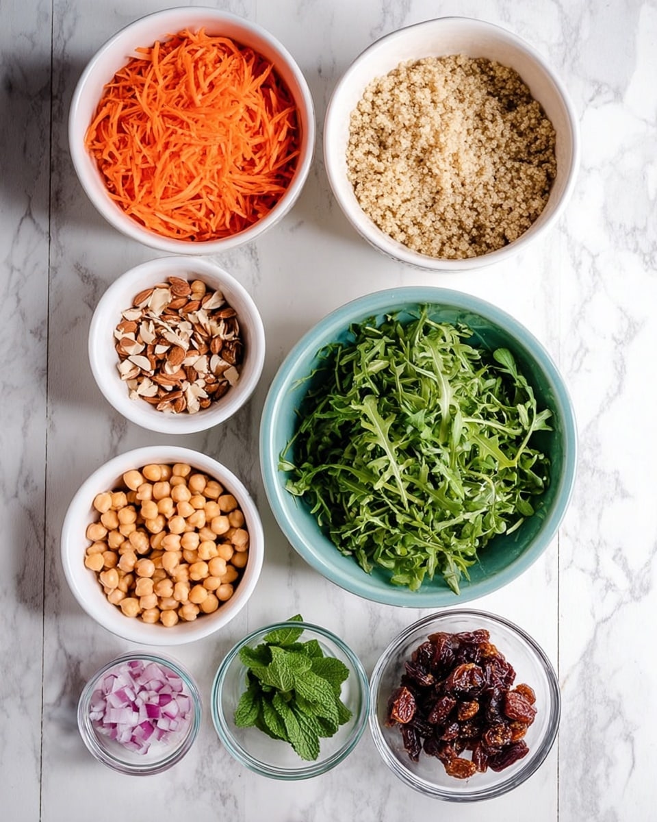 The image shows eight separate bowls arranged on a white marbled surface, each holding different salad ingredients. Starting from the top: a white bowl filled with finely shredded bright orange carrots; a white bowl with small chopped brown almond pieces; a large white bowl holding fluffy, light beige quinoa; a large white bowl filled with fresh, bright green arugula leaves; a medium white bowl with pale yellow chickpeas; a small white bowl with fresh dark green mint leaves; a small clear glass bowl containing finely diced light purple shallots; and a small white bowl with dark reddish-brown chopped dried dates. All bowls are neatly placed, showing a clean and fresh food setup photo taken with an iphone --ar 4:5 --v 7