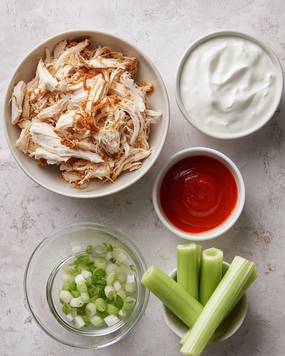 The image shows five separate bowls on a white marbled surface, each bowl containing different ingredients. The largest bowl, positioned at the top left, holds shredded cooked chicken with light beige and golden brown crispy bits. Below it, a white bowl is filled with thick white creamy yogurt. To the right of the yogurt, another white bowl contains a bright red smooth sauce. In the bottom left corner, a small clear glass bowl holds chopped green onions with a mix of light and dark green parts. Lastly, at the bottom right, a small white bowl contains several stalks of fresh, light green celery sticks standing upright. The composition is simple and clean, with the bowls arranged close together in a casual style. photo taken with an iphone --ar 4:5 --v 7