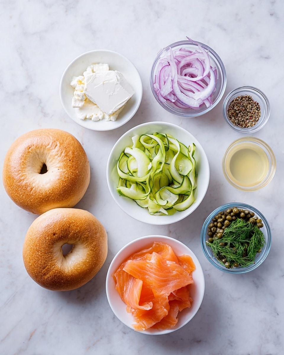 A white toasted bagel is opened flat on a white plate with a white marbled surface beneath. The bottom half of the bagel is spread with a thick layer of white cream cheese mixed with green herbs. On top of that, thin green cucumber slices curl gently along the edges. Bright orange smoked salmon pieces are layered over the cucumber, topped with dark green capers scattered around. Thin slices of purple-red onion curl on top, along with small sprigs of fresh green dill for garnish. The top half of the bagel, also spread with the same herb cream cheese, lies open next to the layered bottom half. Photo taken with an iphone --ar 4:5 --v 7