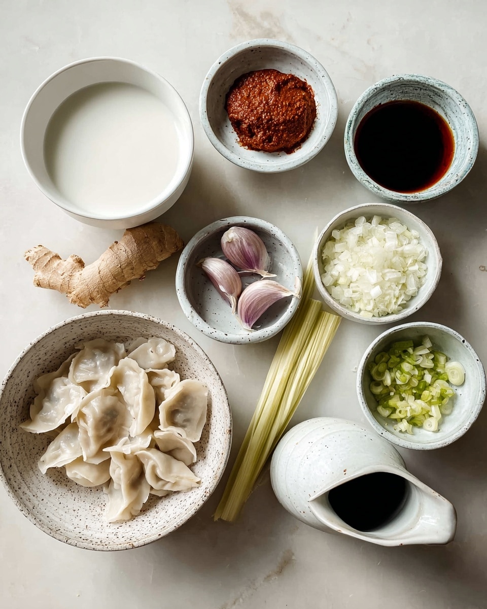 The image shows a top view of several small bowls arranged on a white marbled surface. Starting from the top left, there is a white bowl filled with white coconut milk. To its right is a white bowl with a thick reddish-brown paste. Below the coconut milk are a piece of ginger and a stalk of lemongrass placed side by side. In the center is a white bowl holding three garlic cloves with purple skin. To the right of the garlic is a bowl with finely chopped white onions. Below the garlic is a white bowl with thinly sliced green onions. Next to it on the right is a small white ceramic jug with a dark liquid inside. On the bottom left is a speckled white bowl filled with uncooked dumplings showing their folded edges and pale dough. The overall colors are earthy and natural against the clean white marbled surface. Photo taken with an iphone --ar 4:5 --v 7