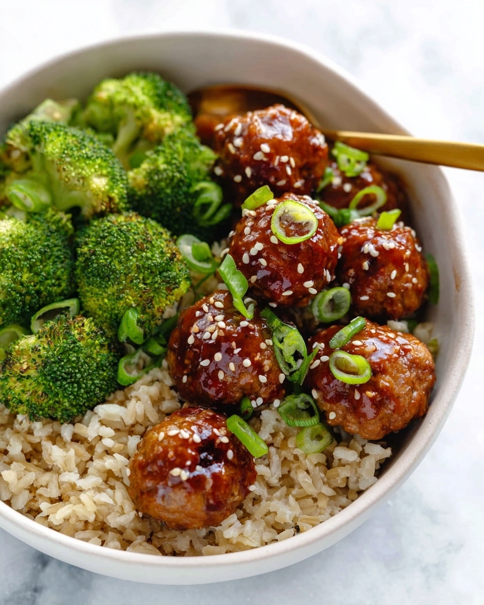 A white bowl filled with many small round meatballs covered in a shiny dark brown sauce, scattered small white sesame seeds are on top, and thin green onion slices are sprinkled over the meatballs; the meatballs appear glossy and slightly textured, floating in the thick sauce that pools at the bottom of the bowl, all resting on a white marbled surface photo taken with an iphone --ar 4:5 --v 7