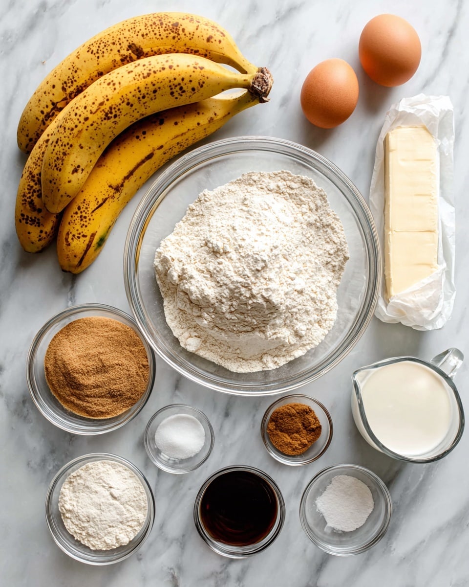 The image shows a white marbled surface with several baking ingredients neatly arranged. On the left, there is a bunch of ripe yellow bananas with brown spots. In the middle, there is a large clear glass bowl filled with white flour. Below it, a smaller clear glass bowl holds light brown sugar. Around these bowls are smaller clear glass containers with white baking powder, ground cinnamon, and a metal cup with salt. At the top right, two brown eggs lie side by side, next to a white wrapped stick of butter. A small clear glass pitcher contains white sour cream, and a tiny clear glass bowl holds dark vanilla extract. The layout is clean and bright, showcasing all ingredients clearly. Photo taken with an iphone --ar 4:5 --v 7