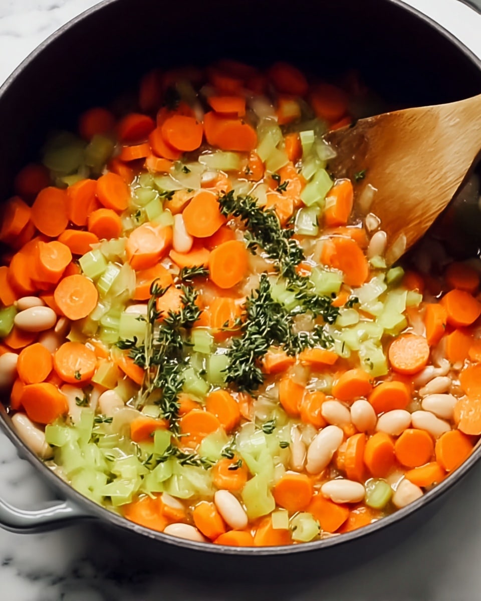 A close-up shot of a pot filled with a colorful mix of sliced orange carrots, chopped light green celery, white beans, and sprigs of green herbs being stirred by a wooden spoon. The orange carrot slices form the main layer with light green celery pieces scattered evenly throughout and white beans mixed in for a soft texture. Small green herb clumps are spread on top adding specks of green. The pot’s dark interior contrasts with the bright vegetable colors, set on a white marbled surface. Photo taken with an iphone --ar 4:5 --v 7