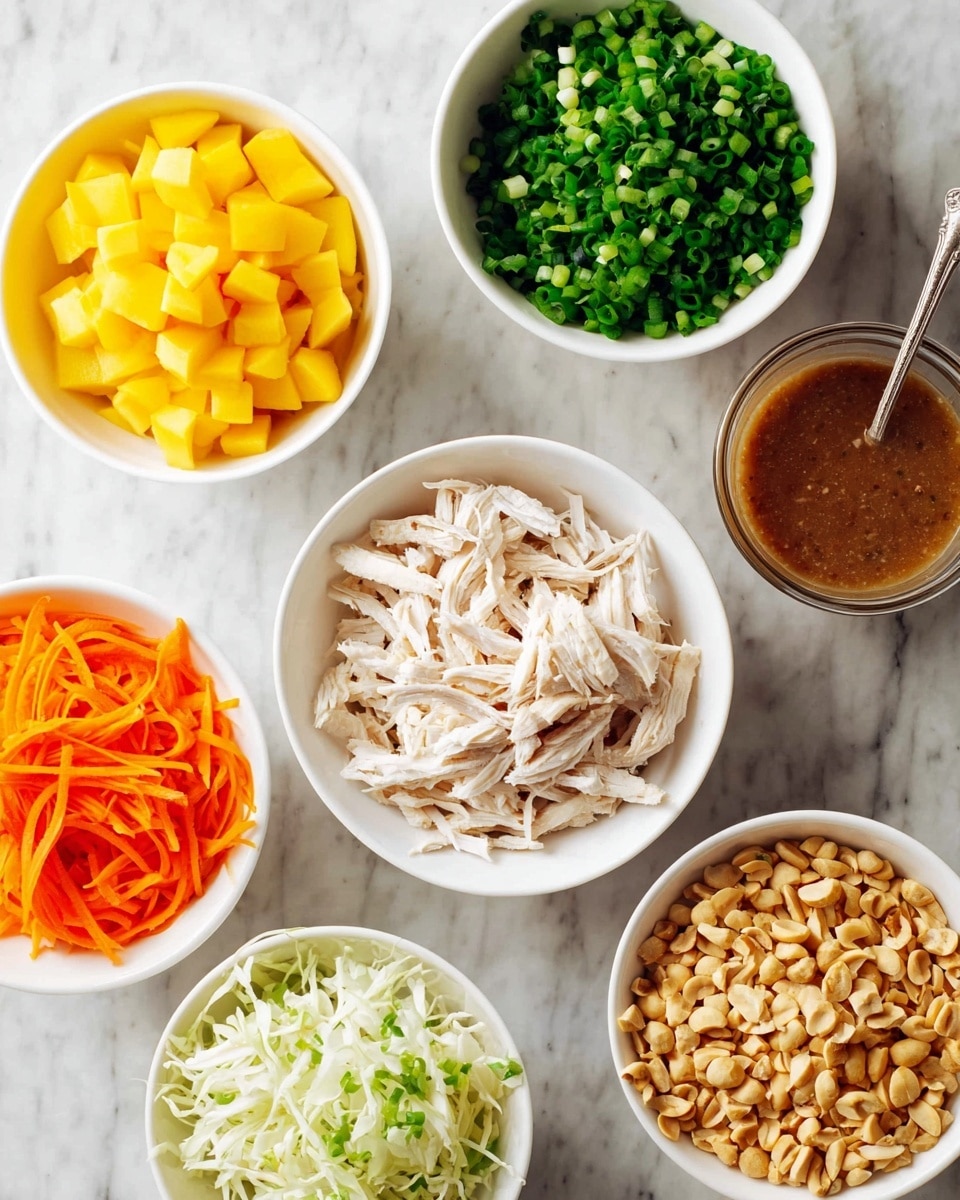 A top view of seven white bowls arranged on a white marbled surface, each bowl holding a different ingredient: one bowl has shredded white chicken in the center, surrounded by bowls containing bright orange shredded carrots, chopped yellow mango, white shredded cabbage, chopped green scallions, chopped green herbs, and crushed peanuts. To the right, there is a clear glass cup with brown sauce and a spoon inside. All bowls have a smooth texture and fresh ingredients look colorful and crisp photo taken with an iphone --ar 4:5 --v 7