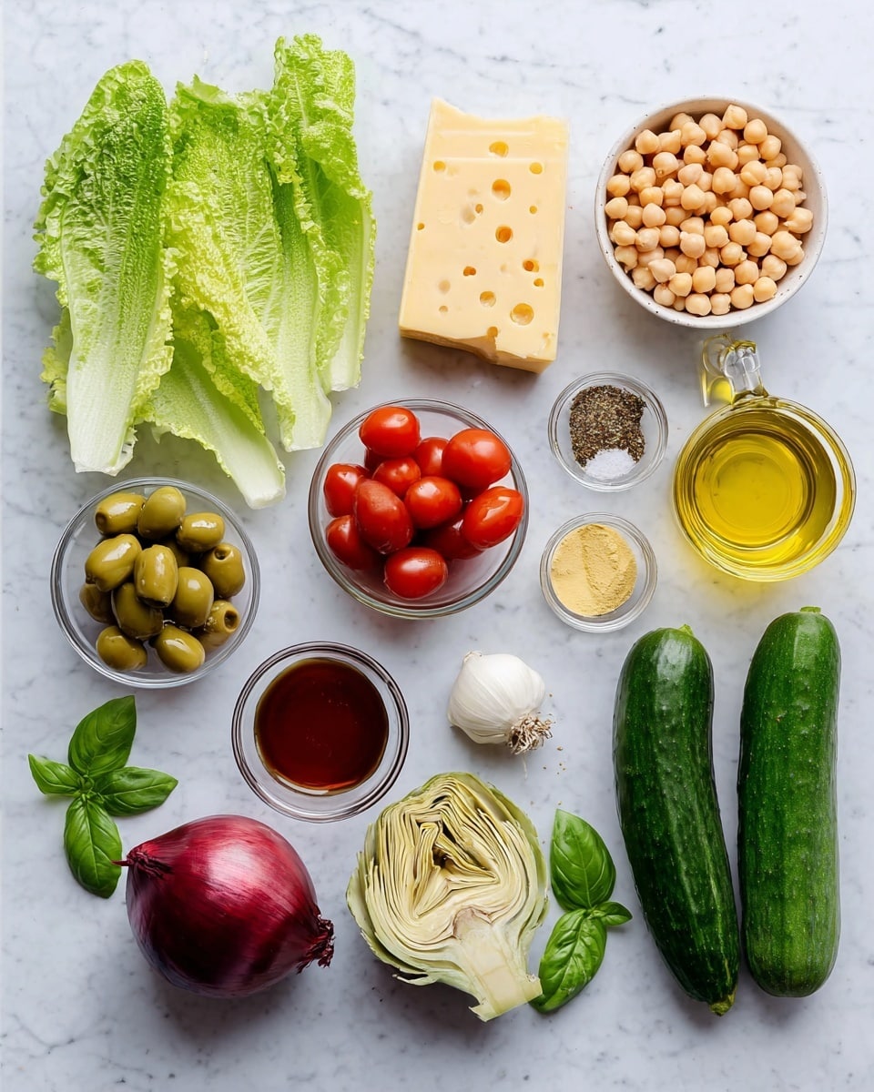 The image shows fresh ingredients arranged on a white marbled surface. There are three long, dark green cucumbers on the right, below a bowl of pale round chickpeas and next to a bowl of green olives and another bowl of pale artichoke hearts. To the left of the cucumbers lies a deep red onion and two large bright green romaine lettuce leaves. In the center-left, a bunch of fresh basil leaves sits beside a small bowl of red cherry tomatoes, some halved. Above this, two large blocks of light yellow cheese stand next to a small glass bowl of light yellow mustard and a small bowl containing a mix of herbs and spices (white salt, black pepper, and dried oregano). A small glass bowl with dark reddish liquid and a clear bottle of golden olive oil complete the arrangement, with a single white garlic clove between the lettuce and chickpeas. photo taken with an iphone --ar 4:5 --v 7