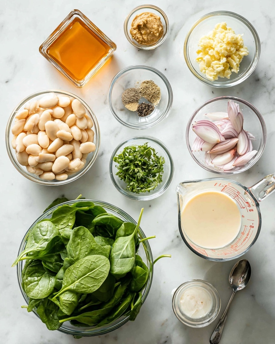 The image shows various ingredients arranged neatly on a white marbled surface. In the center bottom, there is a clear glass bowl filled with fresh green spinach leaves. To the right of it is a clear measuring cup with a creamy white liquid inside. Above this, smaller glass bowls hold minced garlic, pale yellowish miso paste, chopped fresh green herbs, and a mix of salt and black pepper. To the left of these small bowls is a bowl filled with pale white large beans, and next to it is another clear bowl with thinly sliced light purple shallots. Close to the top left corner is a square glass container holding a light orange-brown liquid. The whole setting is bright and clean, showing fresh healthy ingredients prepared for cooking. Photo taken with an iphone --ar 4:5 --v 7