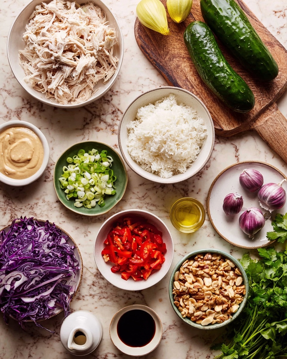 The image shows a top view of ingredients arranged on a white marbled surface. In the center left, there is a white bowl filled with shredded white meat meat, below it a white bowl full of steamed white rice. Moving clockwise, there is a small white bowl of sliced green onions, a small white bowl with a creamy beige sauce, a white bowl with bright chopped red bell peppers, and a white bowl filled with chopped nuts. To the top right, there are four whole green cucumbers and a bunch of fresh cilantro on a wooden cutting board, along with shredded purple cabbage. Near the center, there is a small green dish with yellow paste, two purple garlic bulbs, and a round white plate holding a glass bottle of oil, a small white cup with light liquid, and a tiny bowl with dark sauce. Photo taken with an iphone --ar 4:5 --v 7