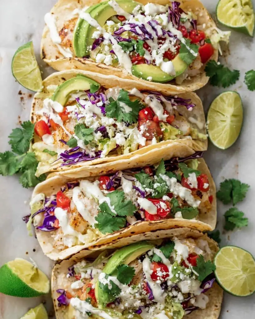 Fish Tacos with Lime Crema and Fresh Toppings Recipe