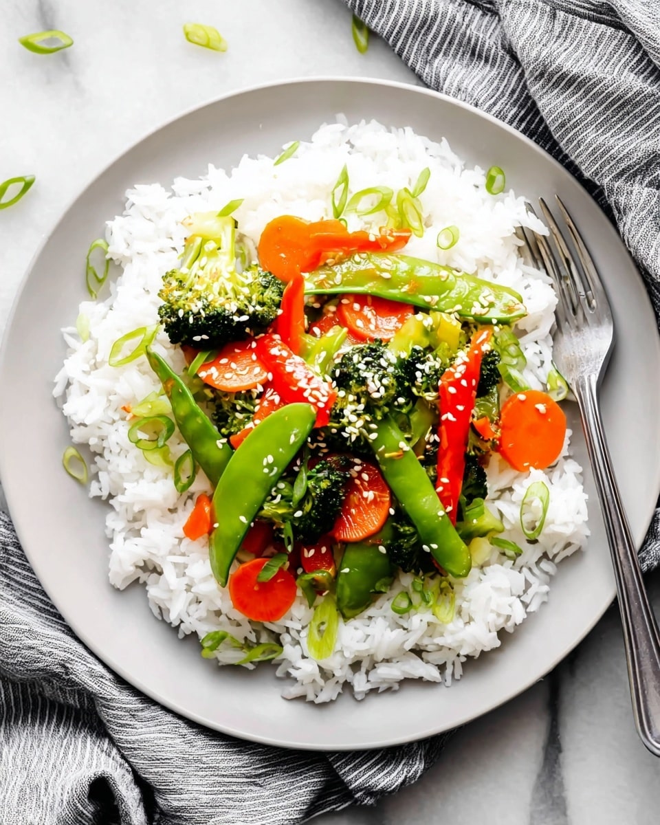 A close-up top view of a stir-fry in a white pan filled with three main layers: bright green snap peas and broccoli florets scattered throughout as the base layer, vibrant orange carrot slices and thin red bell pepper strips mixed in as the middle layer, and thinly sliced green onion pieces sprinkled on top as the finishing layer. The vegetables have a shiny, slightly wet look from a light brown sauce, and the dish is garnished with small white sesame seeds. The pan sits on a white marbled surface. photo taken with an iphone --ar 4:5 --v 7