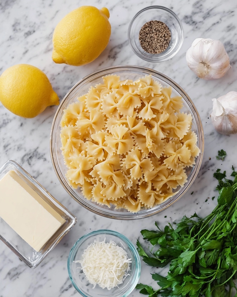 A clear glass bowl filled with dry farfalle pasta sits on a white marbled surface, surrounded by small clear glass bowls holding a cube of butter, salt, cracked black pepper, and grated cheese. To the left, there are two whole lemons, a container of soft white cheese, and fresh green parsley and garlic cloves lying next to them. The arrangement is clean and bright with natural colors standing out against the white marbled background. photo taken with an iphone --ar 4:5 --v 7