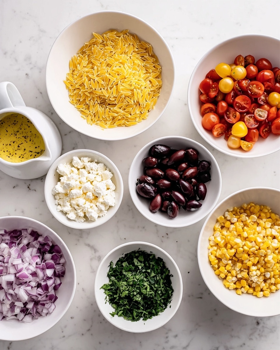 There are eight white bowls and one small white pitcher arranged on a white marbled surface. The bowls hold different ingredients: yellow orzo pasta in the top center bowl, dark purple olives in the top right bowl, red cherry tomatoes cut in halves in the middle right bowl, yellow cherry tomatoes cut in halves in the bottom right bowl, corn kernels in the bottom center bowl, diced red onions in the bottom left bowl, crumbled white cheese in the middle left bowl, and chopped green herbs in a small bowl at the center. The small white pitcher near the center left has a yellow dressing with visible black specks. photo taken with an iphone --ar 4:5 --v 7