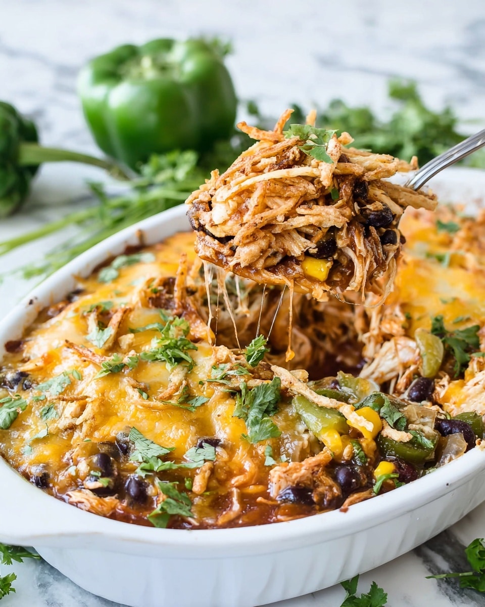 A white oval dish holds a layered dish with five main sections. The bottom and sides are fully covered with shredded white chicken. On top of the chicken, there are three horizontal layers: the top layer is yellow corn, the middle layer is a thick dark reddish-brown sauce running from top to bottom in the center, and the bottom layer is black beans on either side of the sauce. On the left and right edges near the bottom, there are small chunks of bright green bell peppers. The dish is placed on a white marbled surface. Photo taken with an iphone --ar 4:5 --v 7