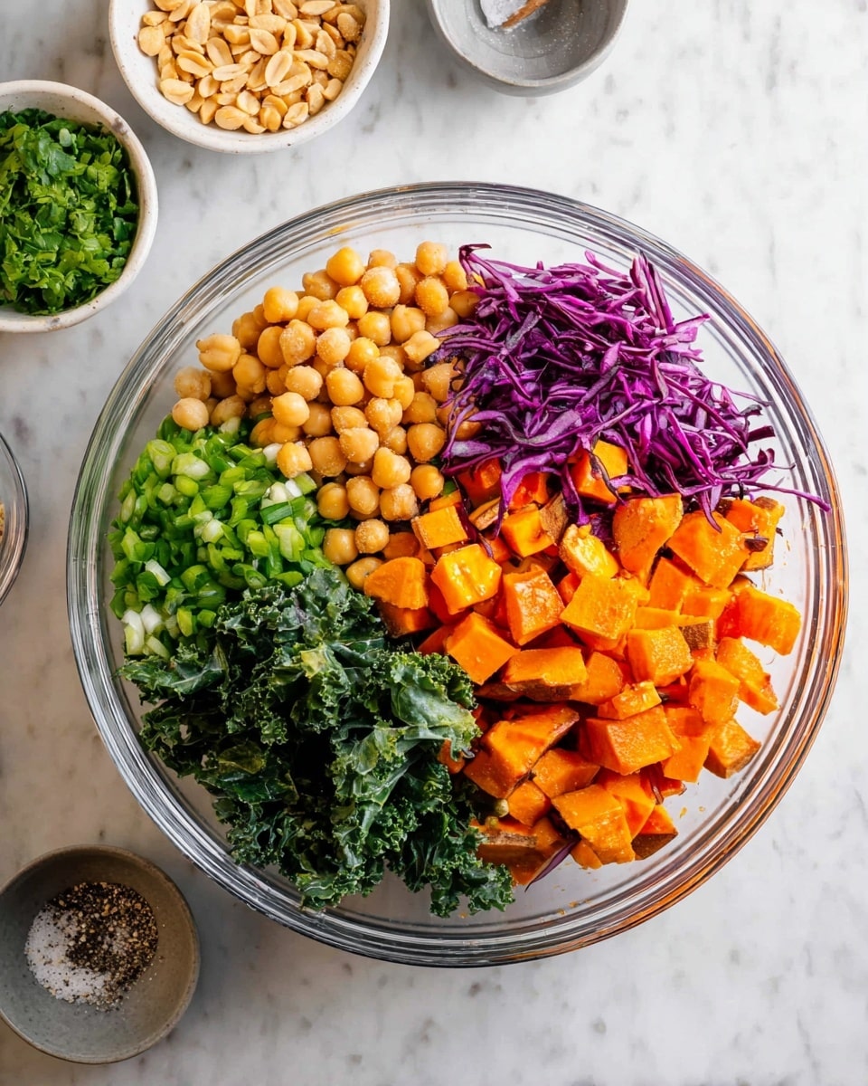 A clear glass bowl holds a colorful salad with five visible layers arranged side by side: light brown chickpeas on the left, bright green chopped scallions at the bottom center, dark green leafy kale on the bottom right, deep purple shredded cabbage on the upper right, and orange roasted cubed sweet potatoes piled in the middle. Around the bowl, there is a small light beige bowl with chopped peanuts at the top left, a white bowl with green chopped herbs at the bottom left, and a small gray bowl with salt and pepper at the bottom center on a white marbled surface. photo taken with an iphone --ar 4:5 --v 7
