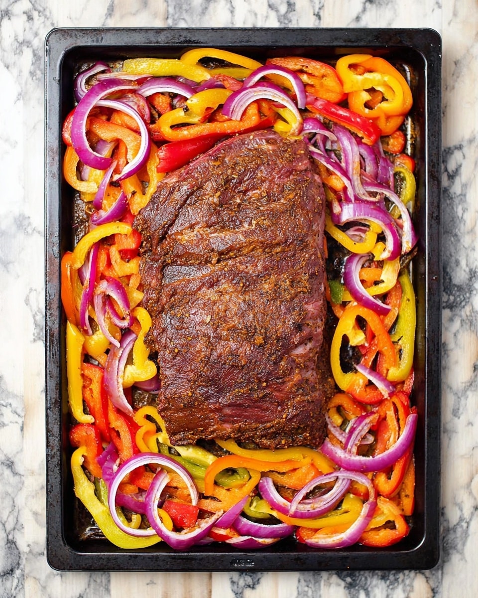 A large piece of cooked meat with a dark brown, slightly crispy textured surface sits in the center of a rectangular black baking tray. Around the meat, there is a colorful mix of sliced bell peppers in red, yellow, and orange, along with rings of red onion, all lightly cooked and scattered evenly creating a vibrant border. The tray rests on a white marbled surface. photo taken with an iphone --ar 4:5 --v 7
