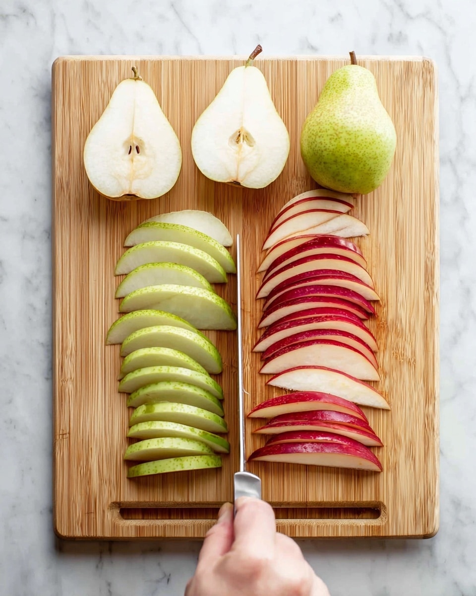 A wooden cutting board is placed on a white marbled surface. On the board, there are two types of pears: green pear slices arranged on the left side in several thin, vertical layers showing both skin and inside flesh, and red pear slices on the right side, also thinly sliced and layered, with smooth red skin and white inside. There are two whole pear halves in the top center, one green and one red, showing the plain inner flesh. A woman's hand is holding a knife slicing through the red pear slices on the right. Photo taken with an iphone --ar 4:5 --v 7