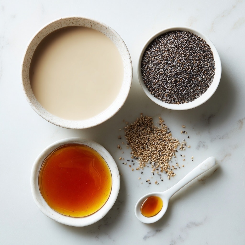 Four small white bowls and plates are placed on a white marbled surface. The largest bowl at the top left is filled with smooth, light beige plant milk. To its right is a white bowl filled to the top with tiny black and white chia seeds that have a slightly shiny texture. Below the plant milk is a smaller white bowl holding dark amber pure maple syrup, reflecting light on its smooth surface. At the bottom, a white spoon-shaped dish holds a small amount of darker amber vanilla liquid. The bowls and dish are evenly spaced, and some scattered chia seeds are visible on the surface. photo taken with an iphone --ar 4:5 --v 7
