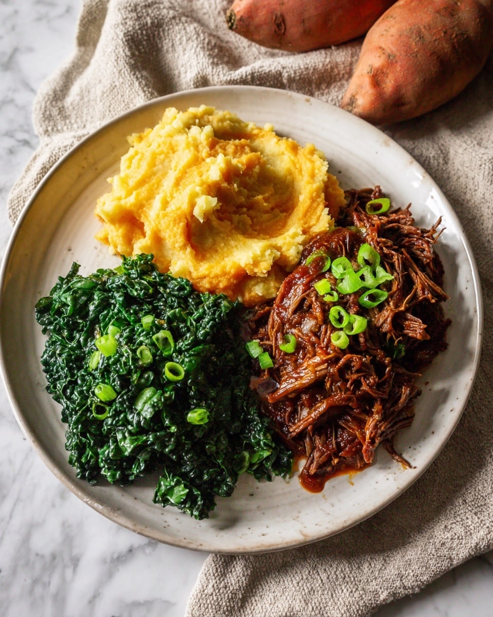 A white round plate with three main layers: creamy mashed sweet potatoes with a light yellow color and slightly chunky texture placed at the top left, dark green steamed kale with visible leaf veins at the bottom left, and rich brown shredded beef in a glossy sauce topped with small green onion slices on the right. The plate is placed on a beige cloth with whole sweet potatoes nearby, all set on a white marbled surface. photo taken with an iphone --ar 4:5 --v 7
