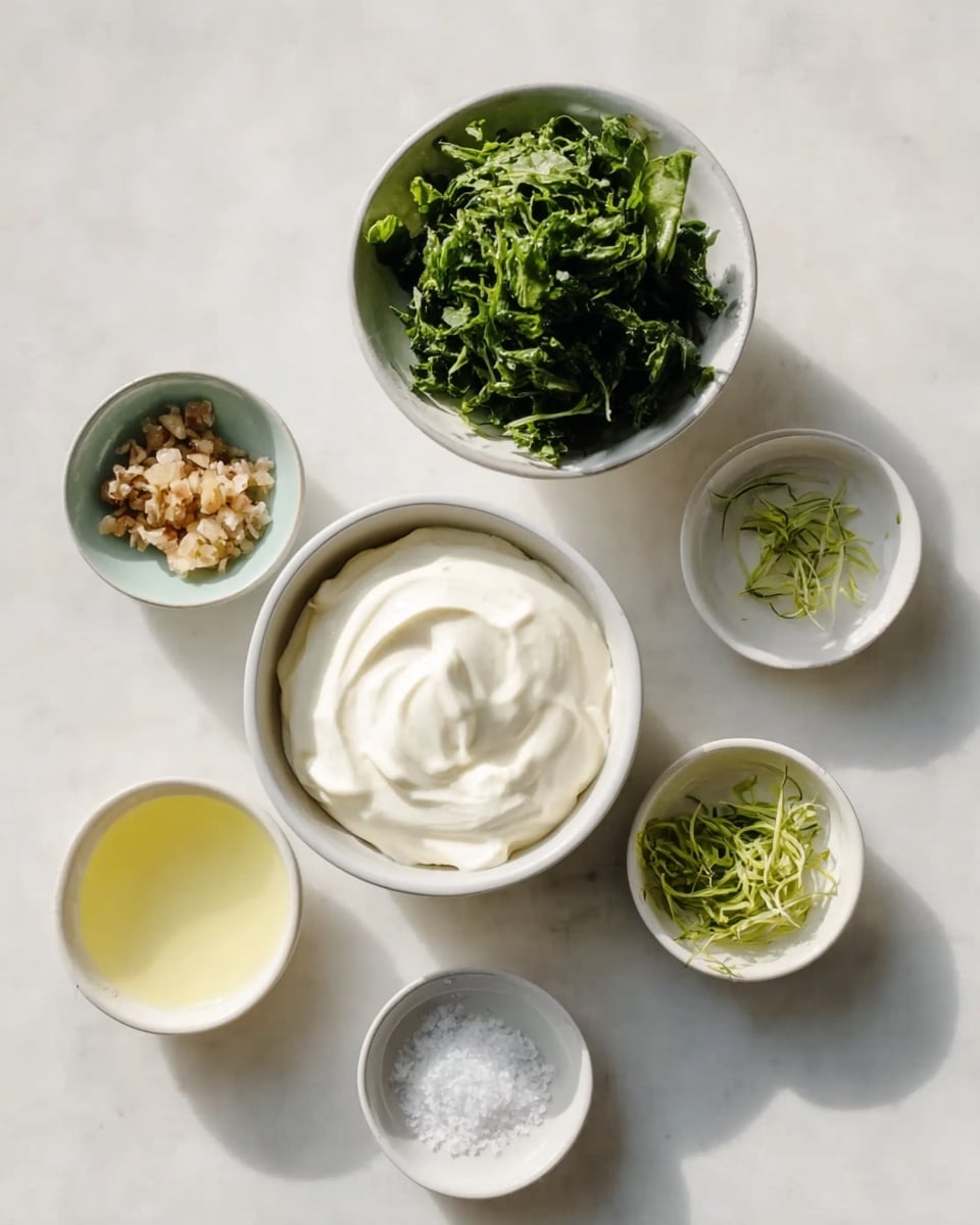 Six small white bowls sit on a white marbled surface, arranged loosely in a circle. The largest bowl in the center holds a smooth, creamy white substance that looks thick and soft. Above this is a bowl filled with bright green leafy herbs that have a fresh, leafy texture. To the left is a bowl with small, light brown minced pieces, which look soft and moist. Below the herbs is a bowl with thin, green zest strands. To the left of this is a bowl with a pale yellow liquid, appearing clear and smooth. At the bottom left is a bowl with some coarse white granules resembling salt. The whole scene is brightly lit with natural light, showing a clean and fresh cooking setup. Photo taken with an iphone --ar 4:5 --v 7
