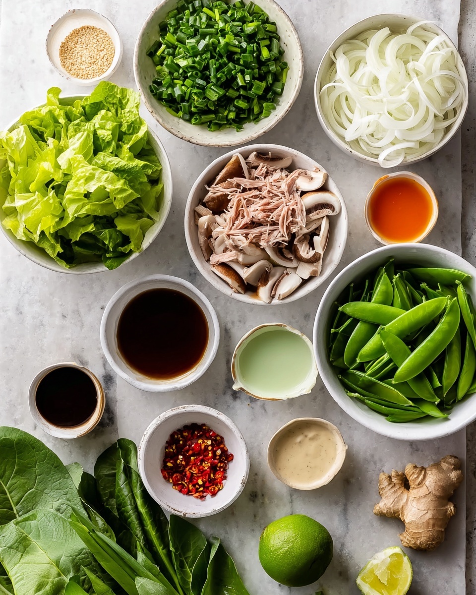 The image shows multiple small white bowls arranged on a white marbled surface, each holding different fresh ingredients. Starting from the left, there is a bowl filled with bright green chopped lettuce leaves, followed by a bowl with thinly sliced white onions on the top right. There are light brown mushroom slices in the center, and a small bowl with shredded tuna below them. Sugar snap peas with vibrant green pods fill a larger white bowl to the right. Surrounding these are smaller bowls containing a reddish-orange liquid, a clear pale green liquid, a creamy white sauce, a dark brown sauce, and light beige sesame seeds. A whole lime and a piece of ginger root sit on the surface. At the bottom, large dark green leafy vegetables are laid out, with a couple of bowls containing chopped green onions and red chili flakes nearby. The entire arrangement is bright, fresh, and tidy. Photo taken with an iphone --ar 4:5 --v 7
