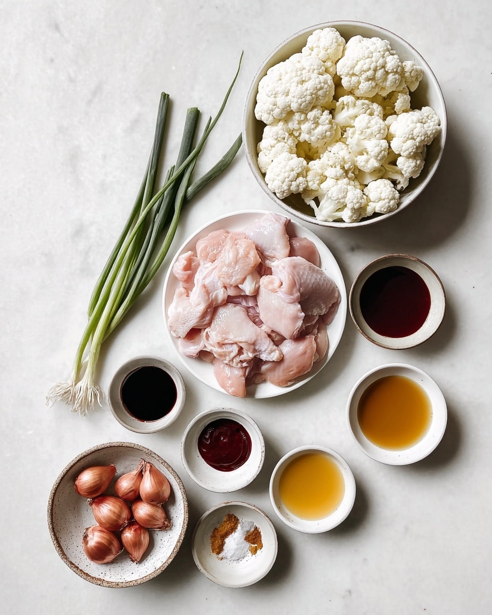A photo shows ingredients neatly arranged on a white marbled surface. At the center, a white bowl holds several thin pale pink raw chicken pieces with skin texture visible. Above it is a white bowl filled with fresh white cauliflower florets, showing detail in their bumpy texture. To the left, green onions with dark green tops and white bottoms lie flat. Around the main bowls, smaller white bowls hold dark soy sauce, deep reddish brown sauce, golden honey, amber vinegar, white coarse salt, and a small amount of brown paste. At the bottom left, a rustic bowl contains five small round shallots with a shiny copper-brown skin. The whole layout is clean and bright with natural light, photo taken with an iphone --ar 4:5 --v 7