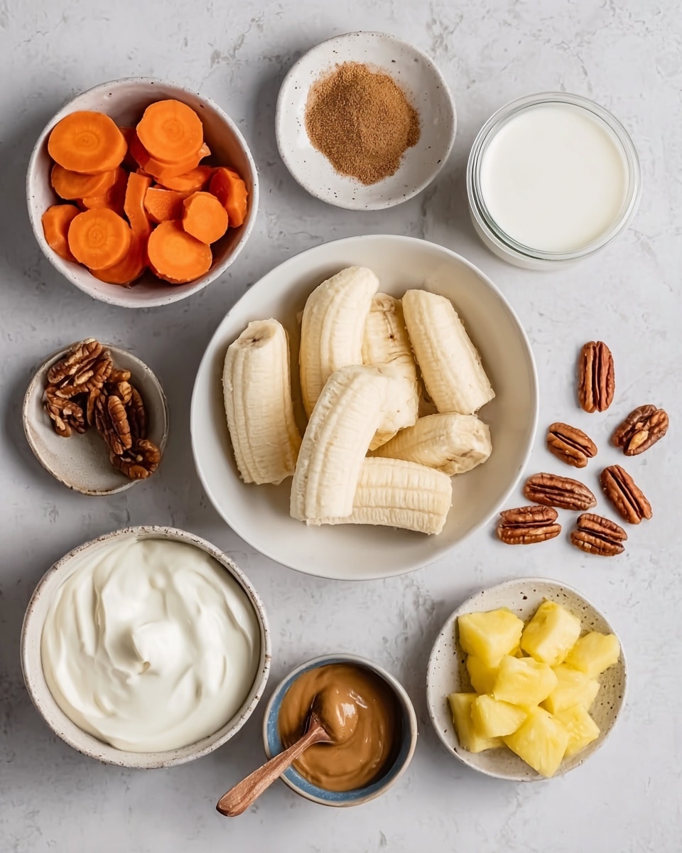 The image shows several small white bowls placed on a white marbled surface, each filled with different ingredients. One large white bowl in the center contains peeled bananas cut into thick pieces with a smooth pale yellow color and soft texture. To the left is a small white bowl filled with round sliced bright orange carrots. Below it is another white bowl with creamy white yogurt, smooth and thick in texture. Below the yogurt is a small white bowl filled with a dark brown liquid, likely vanilla extract. To the bottom right, a white bowl holds yellow pineapple chunks with a juicy texture. To the right, a small brown dish contains a light brown almond butter with a spoon inside. At the top right, there is a clear glass container with white coconut milk. Scattered around are pecan halves and a small white plate with brown cinnamon powder. Photo taken with an iphone --ar 4:5 --v 7