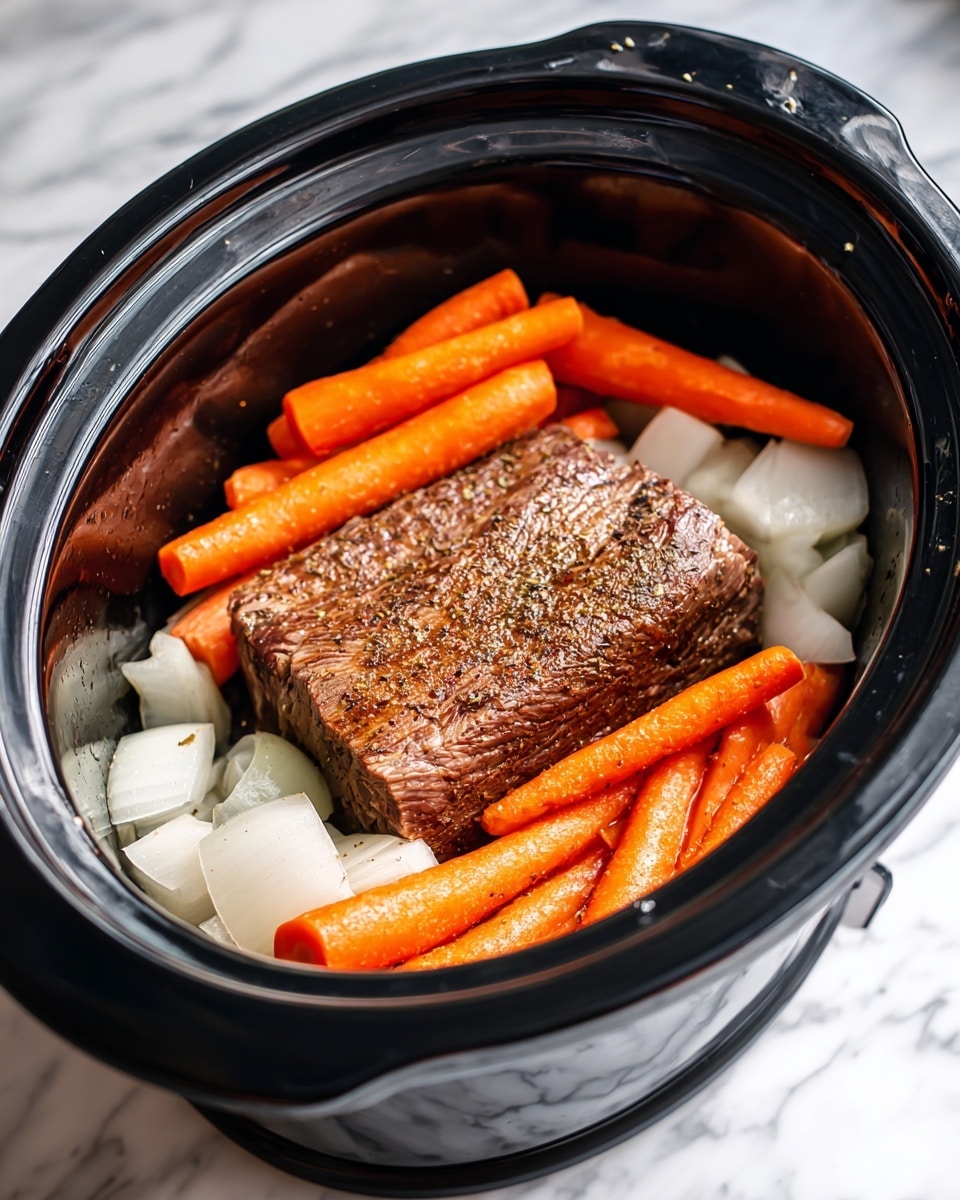 The image shows a black slow cooker filled with layers of food. At the bottom, there are large chunks of white onion pieces spread evenly around the sides. On top of the onions, there are bright orange carrot sticks arranged around the edges of the cooker. In the center of the cooker lies a large, browned piece of meat with a textured surface that shows slight grill marks and seasoning. The slow cooker sits on a white marbled surface. photo taken with an iphone --ar 4:5 --v 7