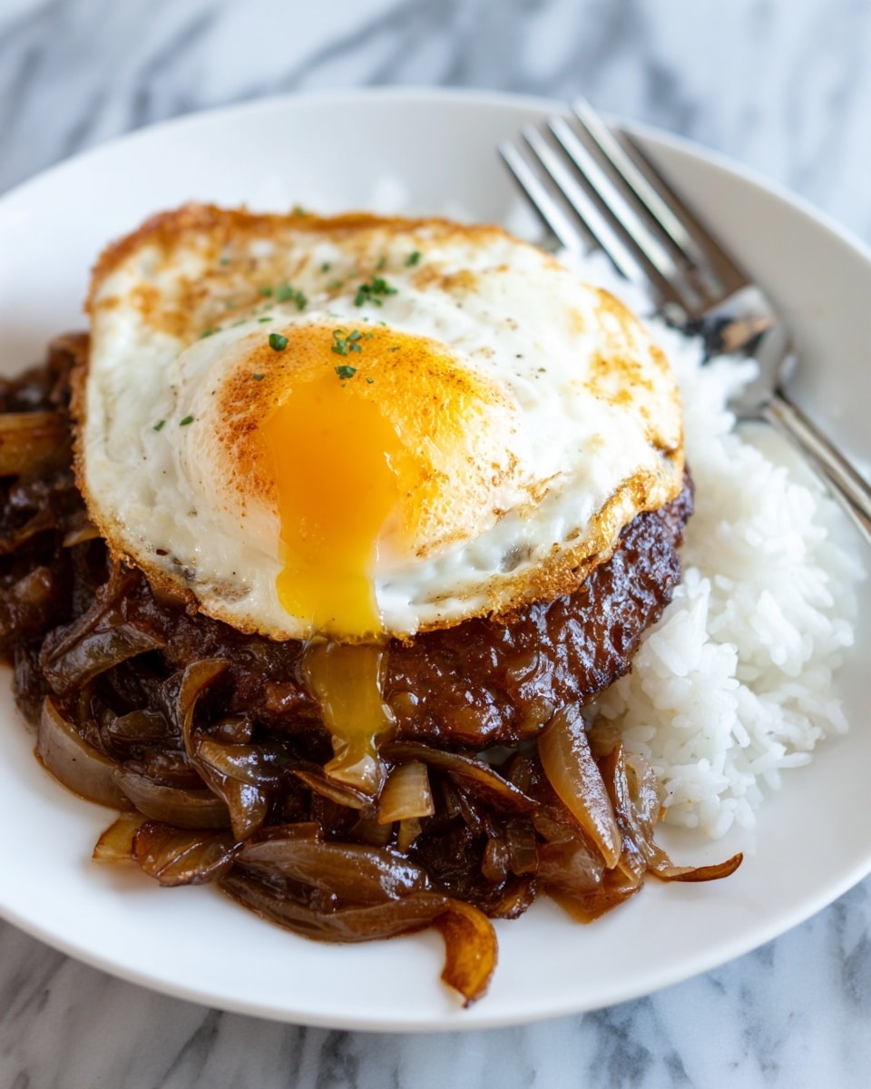 The image shows a close-up of a dish with three main layers on a white plate. The bottom layer is white rice, partly visible on the right side. Above the rice is a thick brown gravy-covered beef patty mixed with cooked onions that are soft and caramelized, giving a mix of dark brown and light brown colors. On top of the beef and onions, there is a fried egg with a slightly browned edge and a bright yellow yolk oozing out on one side. The dish is placed on a white marbled surface, and a silver fork is resting on the right side of the plate. photo taken with an iphone --ar 4:5 --v 7