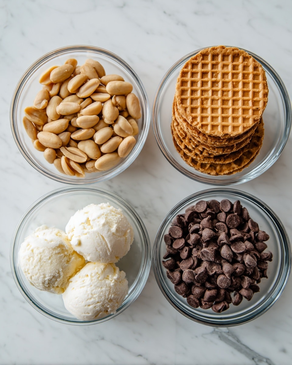 The image shows four clear glass bowls placed on a white marbled surface, each filled with different ingredients. The top left bowl holds light brown roasted peanuts with a smooth, slightly shiny texture. The top right bowl contains a neat stack of five round stroopwafels, each golden brown with a grid pattern on top, and visible edges of caramel filling. The bottom left bowl is filled with soft, creamy white ice cream that looks slightly fluffy with round scoops. The bottom right bowl is full of dark brown chocolate chips that are small, smooth, and shiny. The picture is bright and clear, photo taken with an iphone --ar 4:5 --v 7