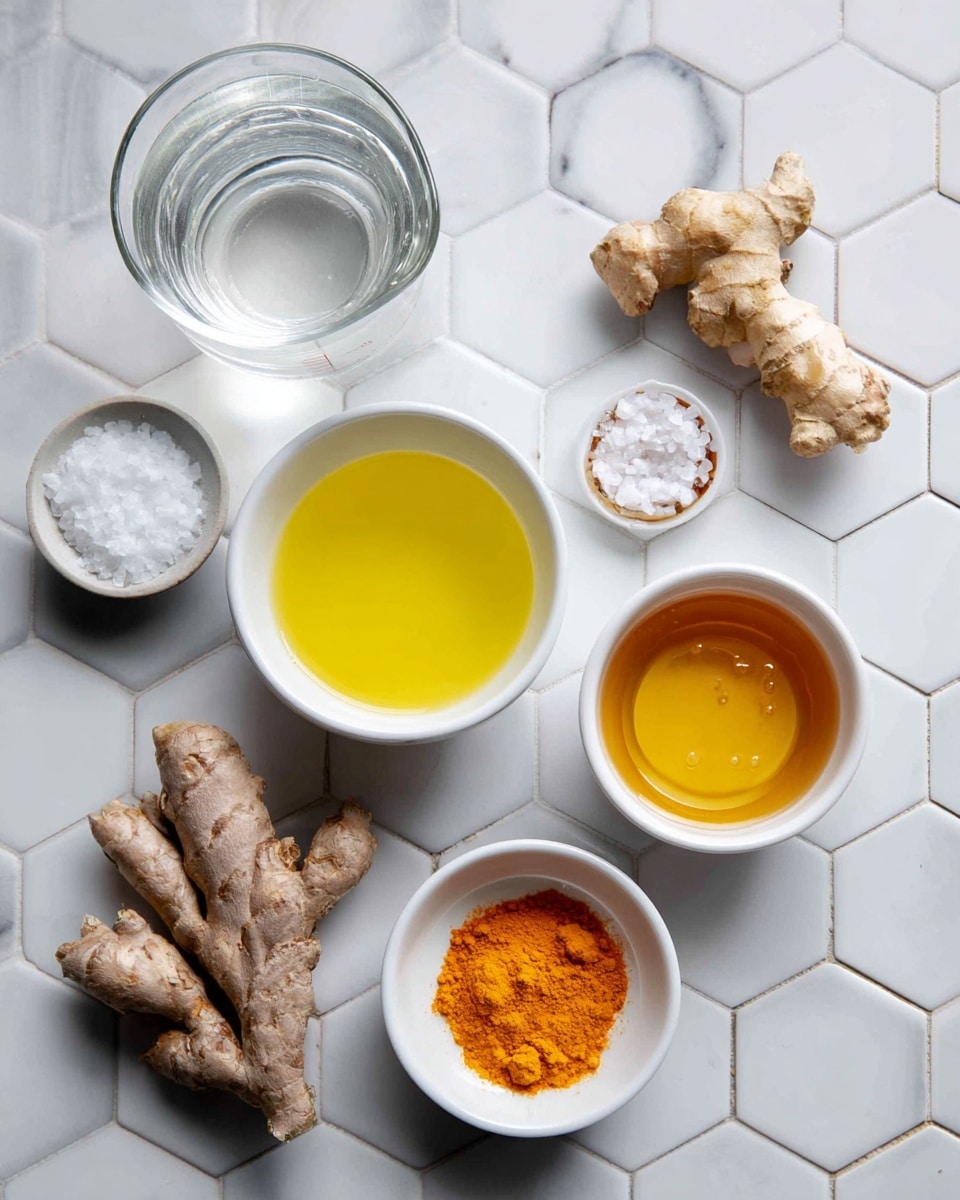 The image shows a clear measuring cup filled with water, placed on a white marbled hexagonal tiled surface. To the right of the cup is a small white bowl filled with bright yellow lemon juice. Below them, a large piece of light brown ginger root and a smaller piece of orange turmeric root lie on the surface. On the bottom left is a white bowl with some salt, while next to it on the right is a white bowl filled with golden honey. Each ingredient is labeled with black text on white boxes placed near or on top of them. The overall setup is bright with natural light. Photo taken with an iphone --ar 4:5 --v 7