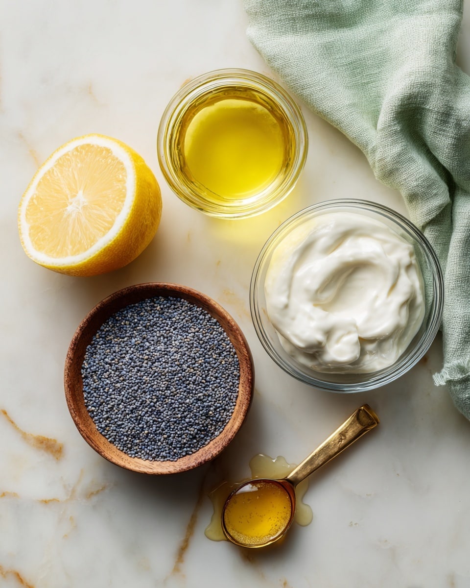 The image shows five food items on a white marbled surface: a clear glass jar with light yellow oil inside near the top center, a half lemon with a bright yellow inside on the left, a small wooden bowl filled with many tiny blue-gray poppy seeds in the center, a small clear glass bowl with white creamy yogurt to the right, and a gold metal measuring spoon with a wooden handle holding a small amount of golden syrup at the bottom right. A pale green cloth is softly folded in the top background. Photo taken with an iphone --ar 4:5 --v 7