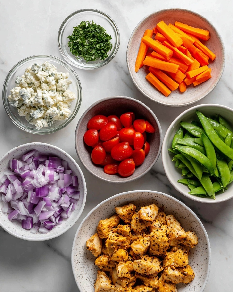 The image shows six white bowls arranged on a white marbled surface, each bowl holding a different ingredient. Starting from the bottom, the largest bowl is filled with uneven pieces of golden-brown cooked chicken with specks of black seasoning. To the right, a speckled white bowl holds long, thin orange carrot sticks neatly stacked. Above that, a white bowl contains fresh green snap peas, some cut in half to reveal the peas inside. To the left of the snap peas, a small round glass bowl is full of finely chopped green herbs. Above that bowl, a speckled white bowl holds crumbly white cheese with hints of blue mold. To the left of the cheese, a white bowl is filled with diced purple-red onion pieces. Below the onions, another white bowl contains halved bright red cherry tomatoes showing their juicy interiors. All the bowls are clean and evenly spaced for a clear view of each ingredient. Photo taken with an iphone --ar 4:5 --v 7
