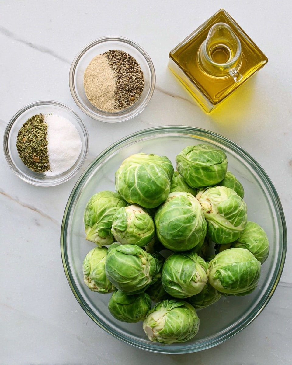 A clear glass bowl filled with green Brussels sprouts, showing detailed texture and shading on each sprout, sits on a white marbled surface. To the left, a smaller clear glass bowl holds four different seasonings: a coarse black pepper, a white powder, a green herb mix, and a light beige powder, each neatly placed in separate sections. Above the seasoning bowl, there is a square clear glass bottle filled with golden olive oil and a spout. The bright natural light makes the green Brussels sprouts and golden oil stand out against the white marbled background. photo taken with an iphone --ar 4:5 --v 7