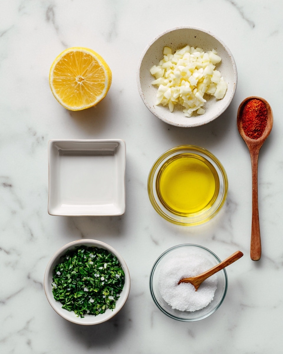 The image shows six cooking ingredients arranged neatly on a white marbled surface. On the top left is a half lemon with its bright yellow flesh and white rind visible. Below the lemon is a shallow bowl filled with finely chopped white garlic pieces. To the right of the lemon, there is a small wooden spoon filled with red spice positioned above a clear glass bowl containing pale yellow oil. Below the oil is a white bowl filled with finely chopped fresh green herbs. On the bottom left, there's a white rectangular salt container filled with white salt and a small wooden spoon resting inside it. On the bottom right, there is a glass bowl with a white powdery substance. Each element is clear and evenly spaced, showing fresh and vibrant colors. Photo taken with an iphone --ar 4:5 --v 7