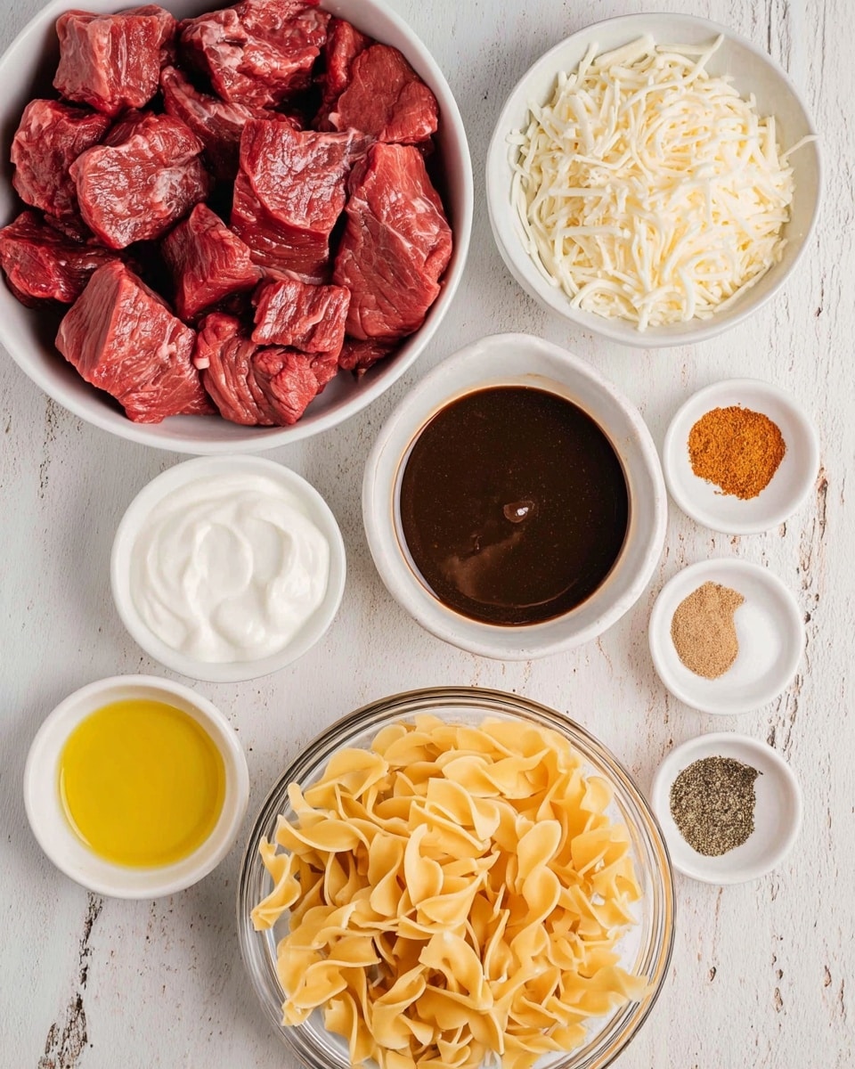 A white bowl filled with raw red beef chunks sits on the left side, with a small round white bowl of yellow oil below it. To the right, below the beef, is a small round white bowl with dark brown liquid. Above this is a small round white bowl full of a dark sauce with light brown pieces around the edges. On the top right, a small round white bowl is filled with white shredded cheese, next to a larger white bowl holding smooth white sour cream. Near the center right, a small round white bowl shows four different spices in separate white sections: black pepper, salt, light brown, and orange powder. At the bottom right, a clear glass bowl holds twisted pale yellow pasta on a white marbled surface photo taken with an iphone --ar 4:5 --v 7