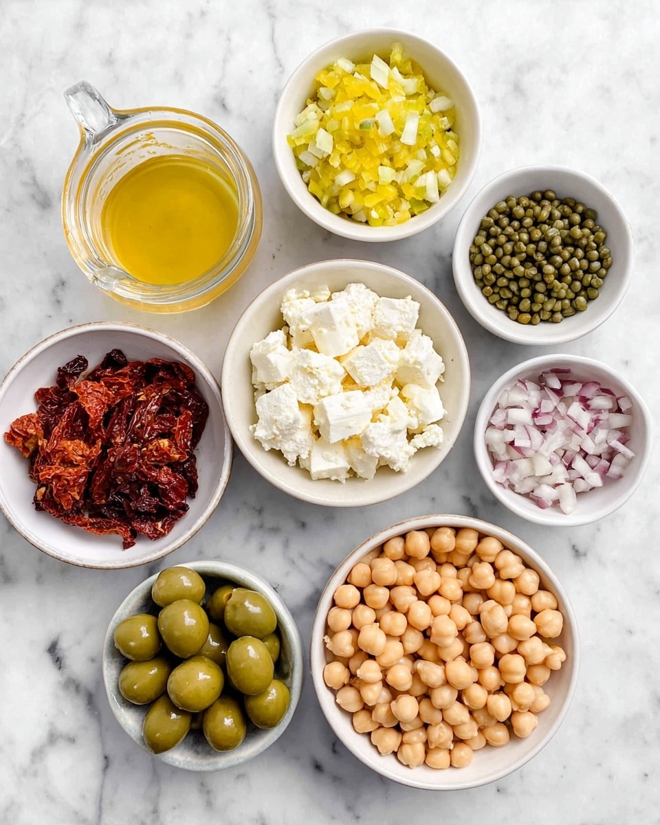 Seven white bowls are arranged on a white marbled surface, each filled with different ingredients. Starting from the bottom right, the largest bowl is filled with light beige chickpeas that have a smooth, round texture. Above it to the right is a small bowl with small green capers. In the center top is a bowl of white feta cheese chunks, rough and irregularly shaped. To the left of it is bright yellow chopped pickles with a slightly shiny texture. Below that is a bowl of dry, dark red sun-dried tomatoes, slightly wrinkled. Below the tomatoes is a bowl filled with sliced green olives showing firm, smooth surfaces. The top left small bowl contains finely chopped shallots, pale pink and white in color. At the bottom left corner is a clear small pitcher filled with golden lemon juice. photo taken with an iphone --ar 4:5 --v 7