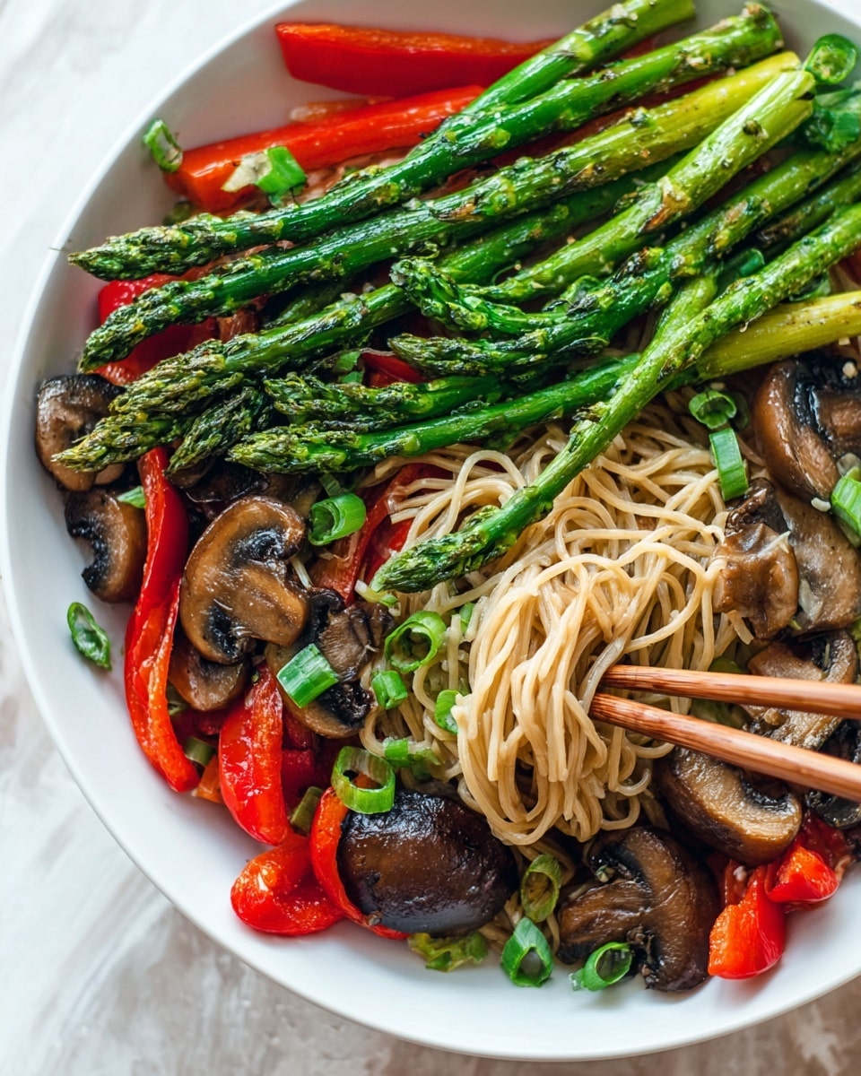 A white plate filled with three main layers: the bottom layer has light brown noodles loosely piled on one side, next is a layer of bright red bell pepper slices and dark brown mushrooms with glossy textures scattered around, and the top layer features vibrant green asparagus spears placed diagonally over the vegetables. Fresh green onion pieces are sprinkled on top for a fresh touch. Two wooden chopsticks are seen picking up food from the noodle side against a white marbled surface background photo taken with an iphone --ar 4:5 --v 7