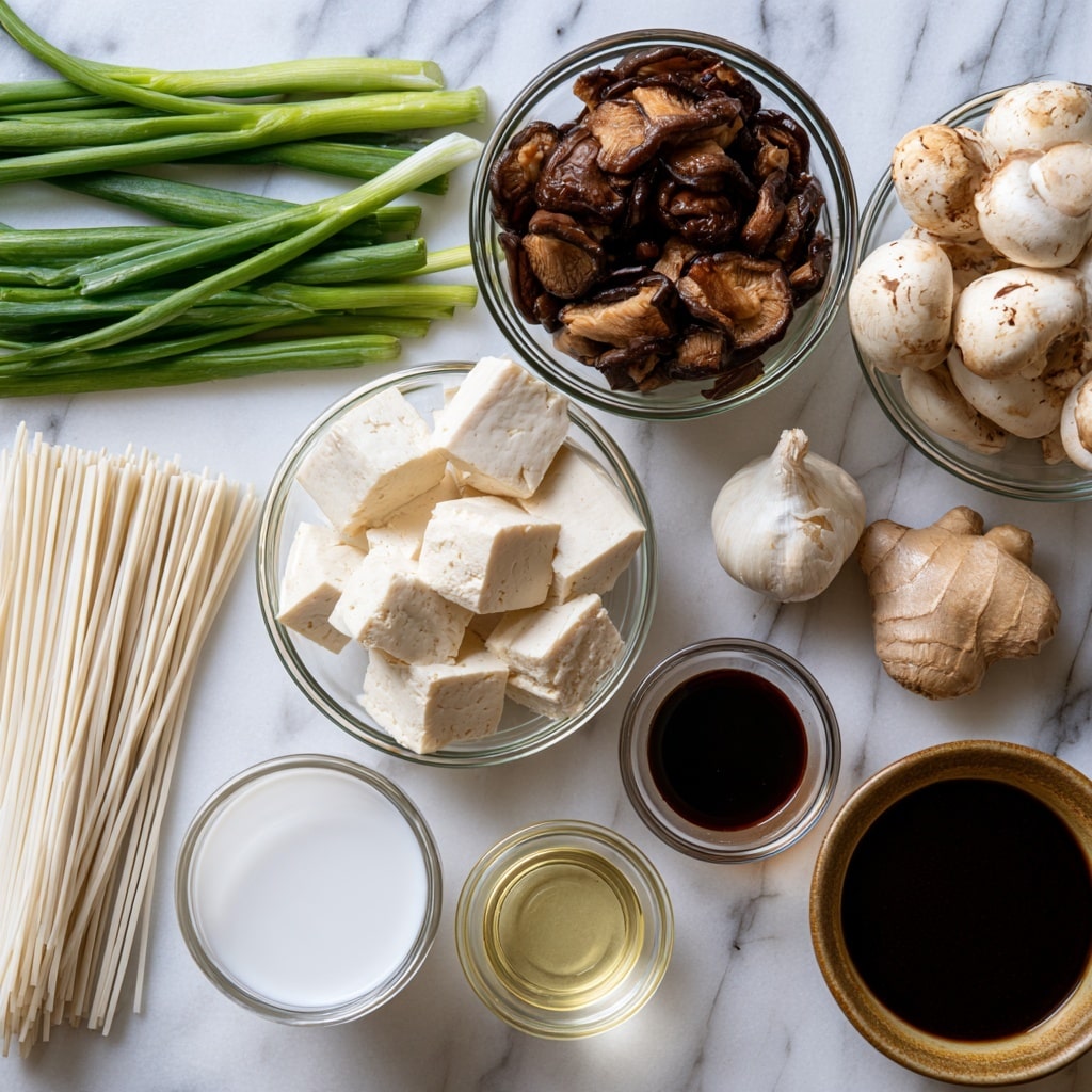 A white marbled surface holds several clear glass bowls and small containers arranged neatly. At the top left, fresh green onions lay flat with bright green stalks. Next to them on the right is a bowl filled with dark brown cooked mushroom slices, while to its right, another bowl contains whole white mushrooms with light brown spots. Below these mushrooms, there is a bulb of garlic and a fresh piece of ginger. Toward the center is a bowl with large cubes of white tofu. On the left side, a pile of straight white noodles rests on the surface. At the bottom left, a clear glass cup contains white coconut milk. Next to it on the right is a small glass cup filled with light yellow sesame oil. Above this is a small glass bowl of dark soy sauce. At the bottom right is a brownish bowl filled with dark mushroom soaking water. All items are spaced out on the white marbled surface. Photo taken with an iphone --ar 4:5 --v 7