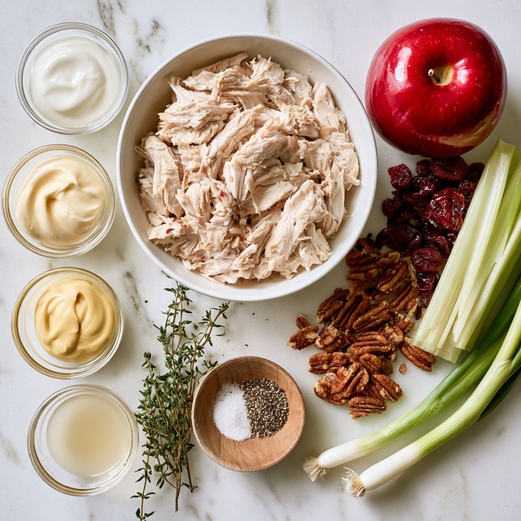 The image shows ingredients for a chicken salad recipe laid out on a white marbled surface. In the center, there is a large white bowl filled with light beige shredded chicken. To the left, there are three small clear glass bowls stacked vertically, containing plain Greek yogurt (white and creamy), mayonnaise (thick and white), and Dijon mustard (smooth and pale yellow). Next to them is a small clear bowl with apple cider vinegar, pale yellow and transparent. Below these ingredients is a small wooden bowl holding a mix of salt and black pepper, white and black specks. Fresh or dried thyme, green and small, is placed close by. On the right side of the chicken bowl, a bright red apple with a shiny skin sits next to a small pile of dried cranberries, dark red and wrinkled. Nearby is a group of pecans, brown and textured, and pieces of celery stalk, light green with a slightly fibrous texture. Lastly, three green onions with long green stalks and white bulbs are on the bottom right. All items are arranged neatly and clearly visible. photo taken with an iphone --ar 4:5 --v 7