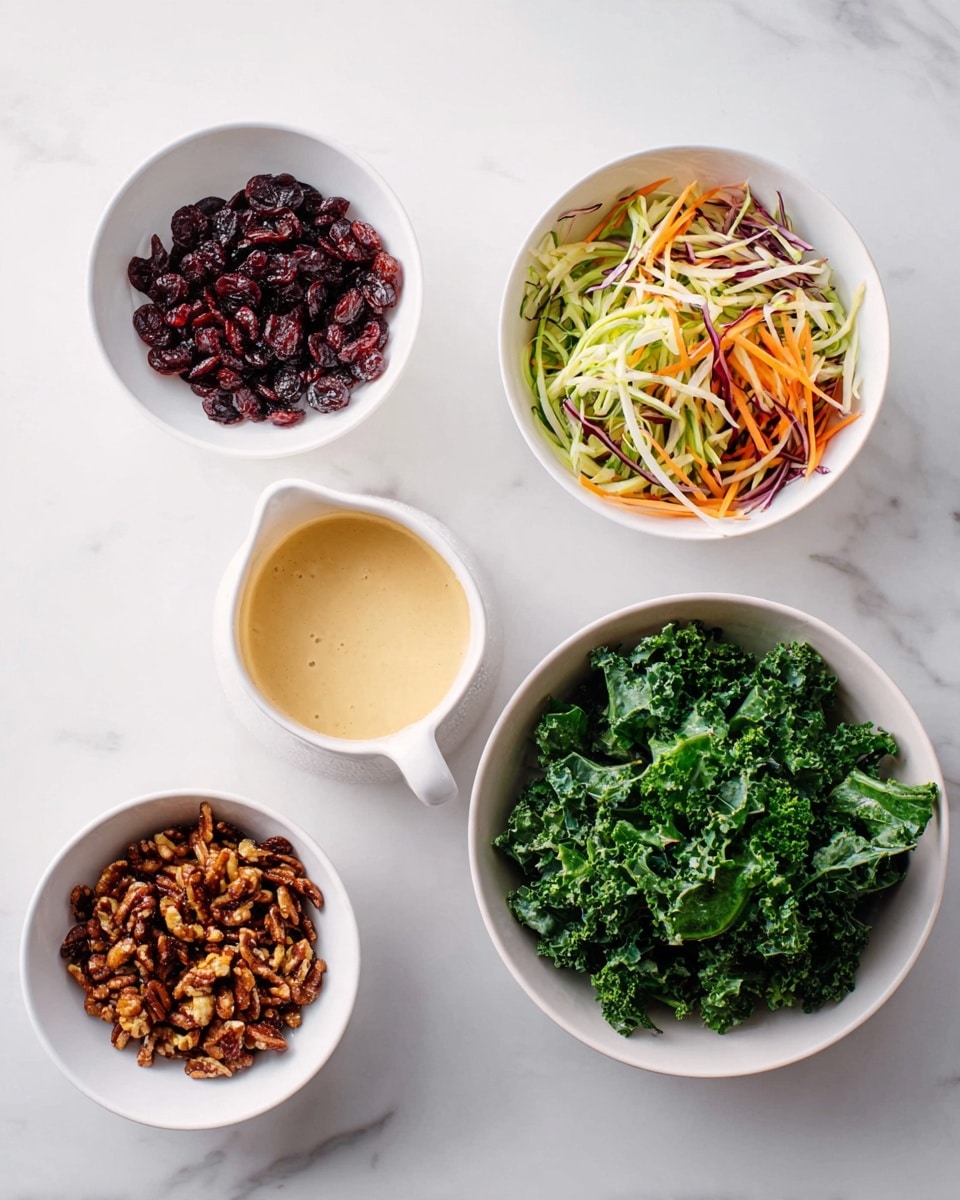 The image shows five white bowls and a small white pitcher arranged on a white marbled surface. Starting from the top left, one bowl contains small dark red dried cranberries with a slightly wrinkled texture. Next to it on the right is a small pitcher filled with a creamy light beige sauce. Below the cranberries bowl, there is a bowl with shredded vegetables including light green, orange, white, and purple thin strips, giving a fresh and colorful look. In the center bottom, there is a bowl filled with a mix of brown candied nuts that look crunchy and irregularly shaped. To the right of this is a bowl filled with fresh green kale leaves that look curly and leafy. photo taken with an iphone --ar 4:5 --v 7