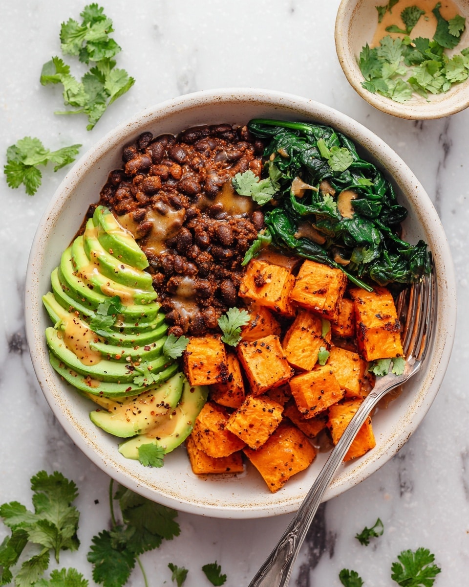 The dish is served in a white bowl filled with four main layers arranged in sections. The first layer on the left side is dark brown mixed beans with a chunky texture and some sauce on top. Next to it on the right are bright orange roasted sweet potato cubes, sprinkled with black pepper. To the right of the sweet potatoes is a layer of cooked dark green leafy spinach, slightly shiny from being cooked. On both the left and right edges of the bowl are thin slices of green avocado, fanned out with a drizzle of sauce on top. The bowl sits on a white marbled surface, with fresh cilantro leaves scattered on the dish and around the bowl. A silver fork rests inside the bowl at the bottom right. Photo taken with an iphone --ar 4:5 --v 7