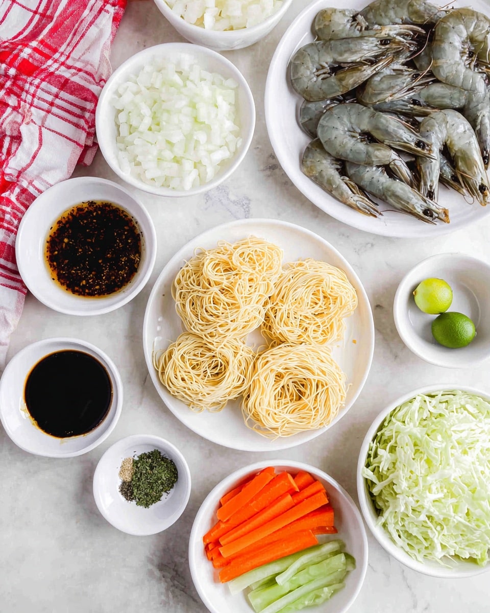 The image shows many white bowls and plates placed on a white marbled surface, each holding different ingredients. In the center is a white plate with three loose light yellow noodle bundles. To the right, a white bowl holds whole prawns with greyish-blue shells. Next to it, a white plate is divided into three sections with bright orange carrot sticks and two green vegetable sections. Above the noodles is a white bowl with chopped white onions. Small white bowls hold a dark brown sauce, chopped green herbs, black pepper with white salt, and several small green citrus fruits, some whole and one cut in half, showing light green insides. The lower right corner shows a white bowl filled with pale green shredded cabbage. A red and white checked cloth peeks in from the top left corner. Photo taken with an iphone --ar 4:5 --v 7