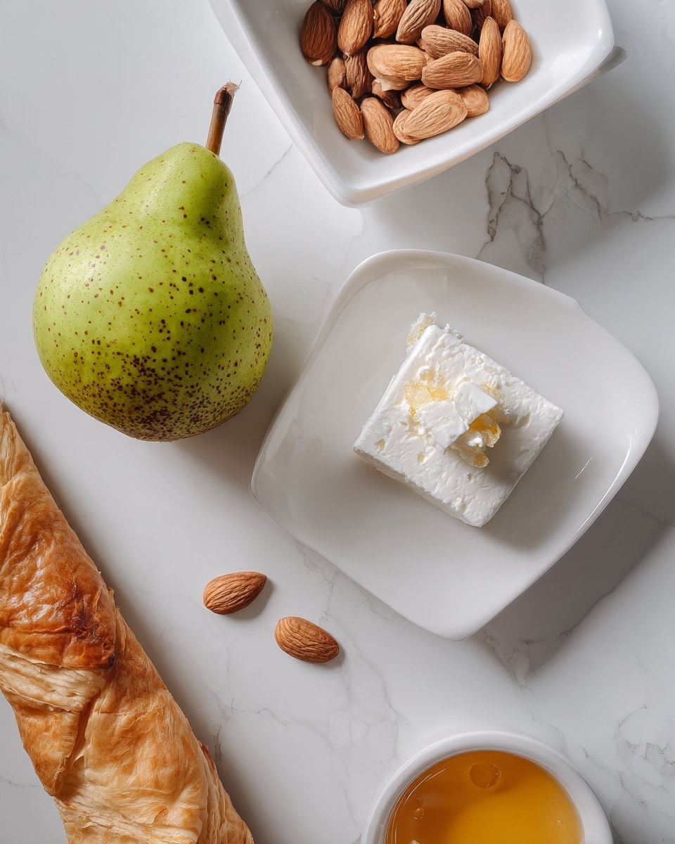 A green pear with brown speckles rests on a white marbled surface next to a white square dish holding light beige almonds. Nearby, a white curved plate contains a block of white feta cheese with a small triangular piece placed on top. Beside the plate is a small white bowl filled with golden honey. Below all these, a rolled sheet of light brown puff pastry lies horizontally on the white marbled background. photo taken with an iphone --ar 4:5 --v 7