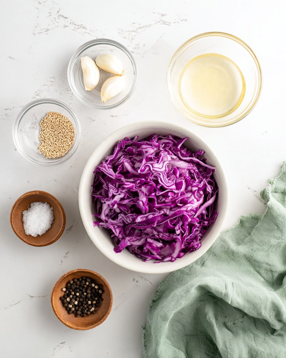 The image shows a white bowl filled with roughly shredded purple cabbage at the bottom center. Above and around it, several small clear glass bowls hold various ingredients: three garlic cloves in the top middle bowl, light brown mustard seeds in a small wooden bowl to the upper left, a pale yellow liquid in a glass bowl to the upper right, coarse white salt in a glass bowl near the bottom left, and black peppercorns in another small wooden bowl at the bottom right. A soft green cloth is casually placed near the bottom right corner on a white marbled surface. Photo taken with an iphone --ar 4:5 --v 7